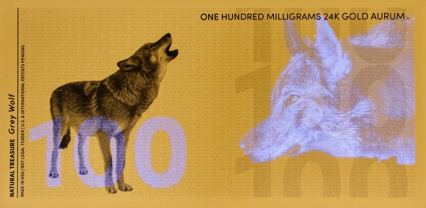 reverse of 100mg gold aurum gray wolf bill showing the uv designs