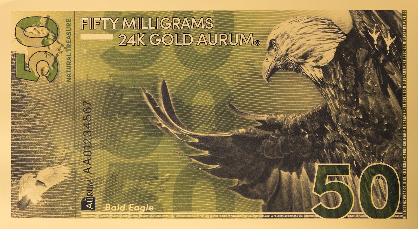 front of 24k 50mg gold natural treasure bill featuring micro printing serial number and various security features in the design