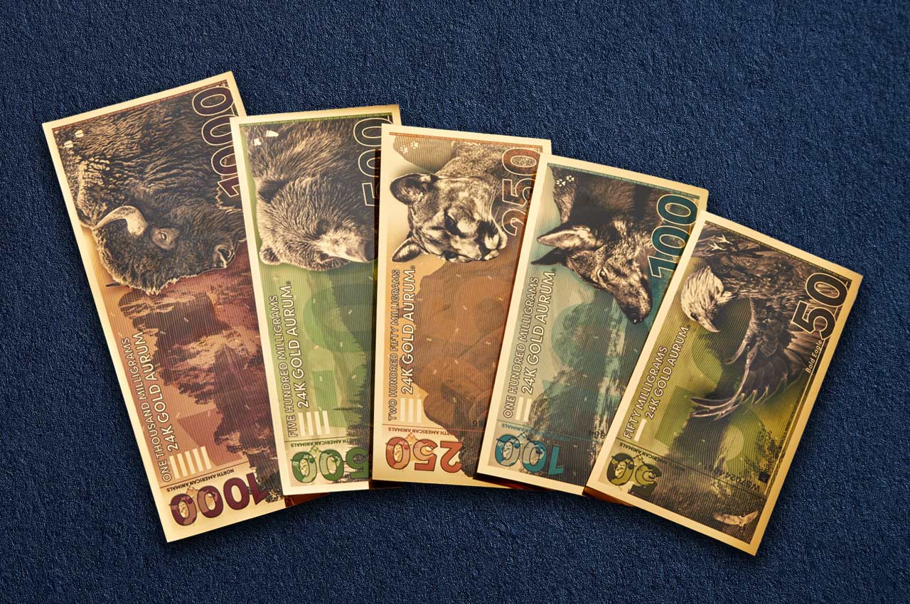 north american animal collection of the gold bullion series showing the 24k gold bills fanned ranging from 50mg to 1 gram of gold weight