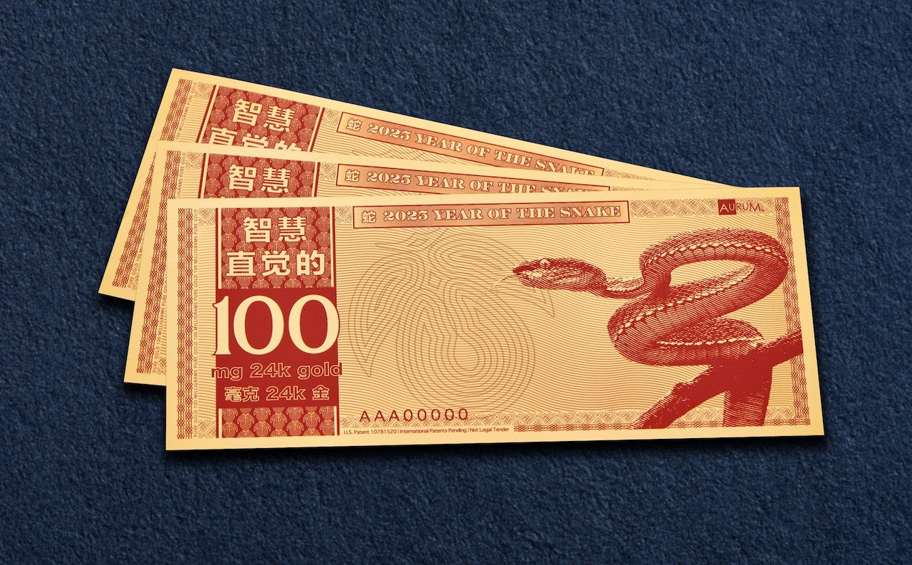 year of snake gold bill gifts shown fanned out in a collection